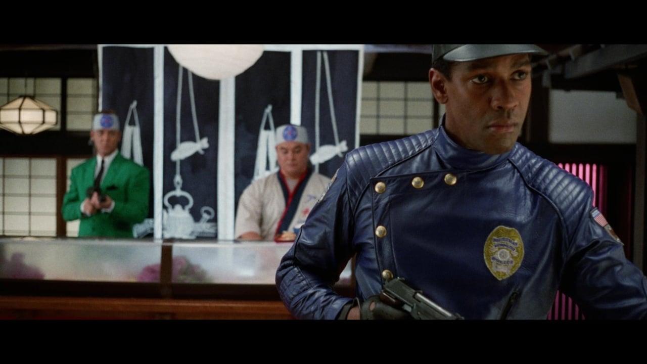 A person in a blue uniform, holding a gun, stands in the foreground, while two others in colorful uniforms are in the background with a decorative curtain featuring scales and fish.