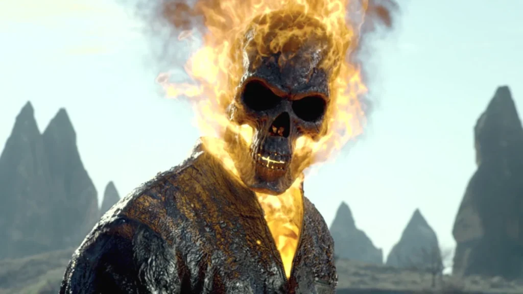 A character with a flaming skull and a charred leather jacket stands in a rocky landscape.