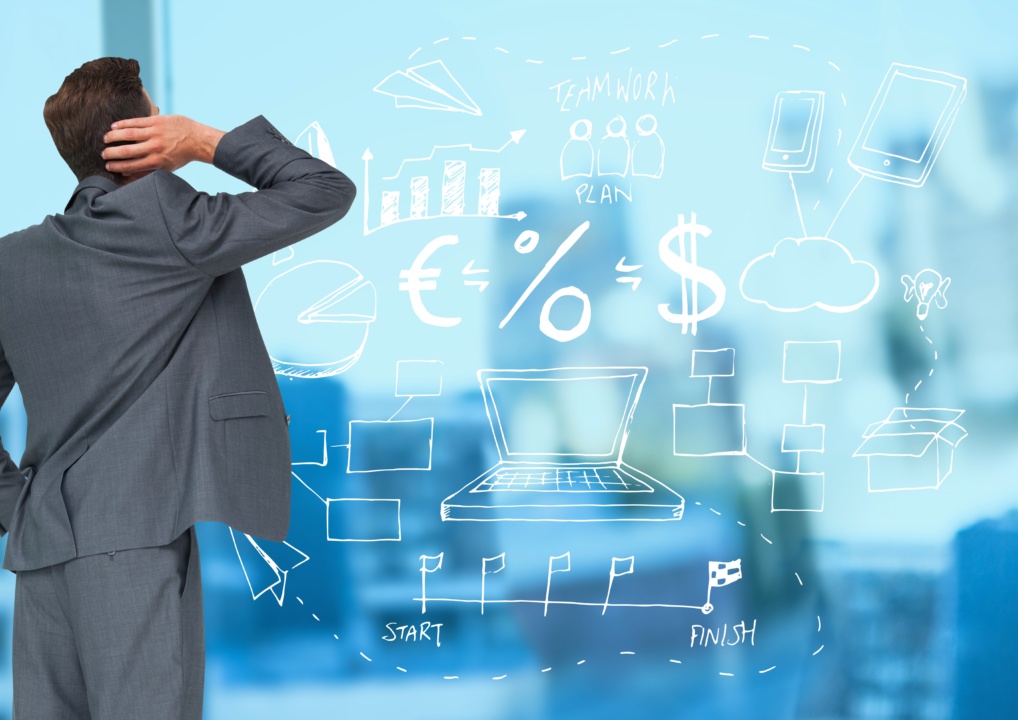 Man in suit observing business-related doodles on clear glass, including symbols for currency, technology, teamwork, and planning.