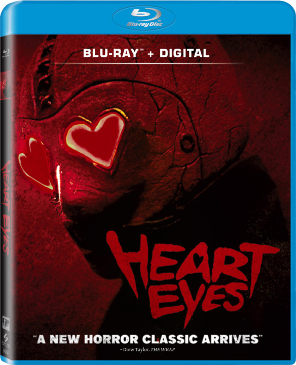 Blu-ray cover of "Heart Eyes" featuring a masked figure with heart-shaped lenses and the tagline "A New Horror Classic Arrives.