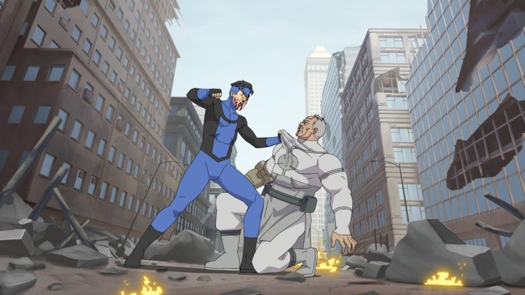Two animated characters in a battle within a destroyed urban landscape. One is in a blue and black suit raising a fist, while the other, in white armor, kneels with a broken helmet.