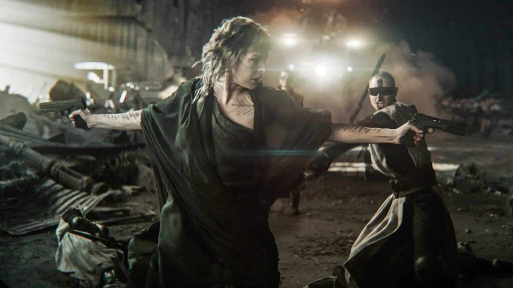A woman in a dark outfit holds two guns in a post-apocalyptic setting. Another person in the background is wielding a sword. Debris is scattered around them.