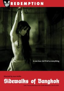 Red-tinted cover of "Sidewalks of Bangkok" featuring a woman in chains. Text: "In one hour she'll tell us everything." Directed by Jean Rollin.