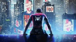 A superhero in a red and blue suit with a spider emblem sits on a ledge overlooking a cityscape with screens displaying various images, including ones labeled "Public Enemy." Snow is falling.
