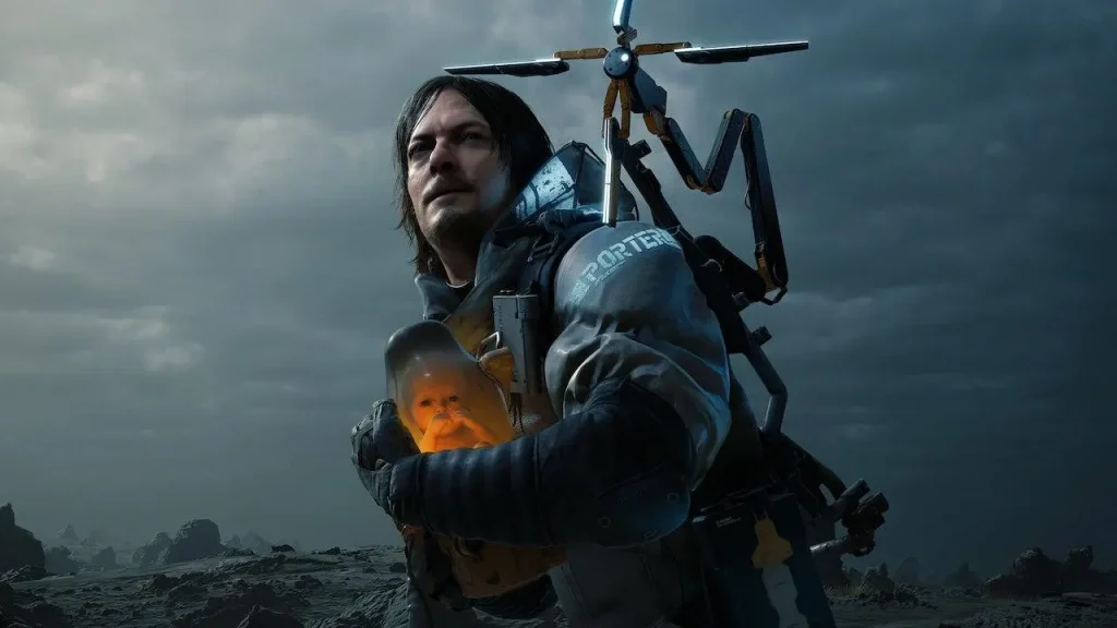 A person stands in a desolate landscape, wearing a special suit and carrying a small, glowing capsule with a baby inside. The sky is overcast with dark clouds.