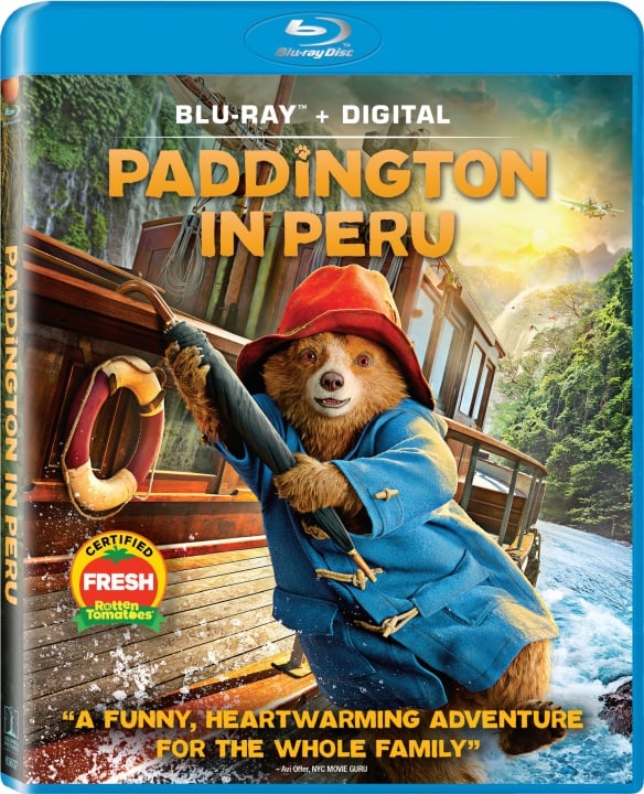 Blu-ray cover of "Paddington in Peru" featuring Paddington Bear in a blue coat and red hat, holding a rope on a boat.