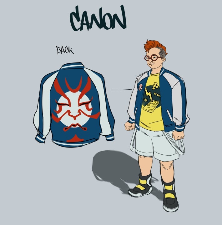 A person with short red hair wears glasses, a blue and white jacket with a large red mask design on the back, a yellow T-shirt, shorts, and high-top sneakers.