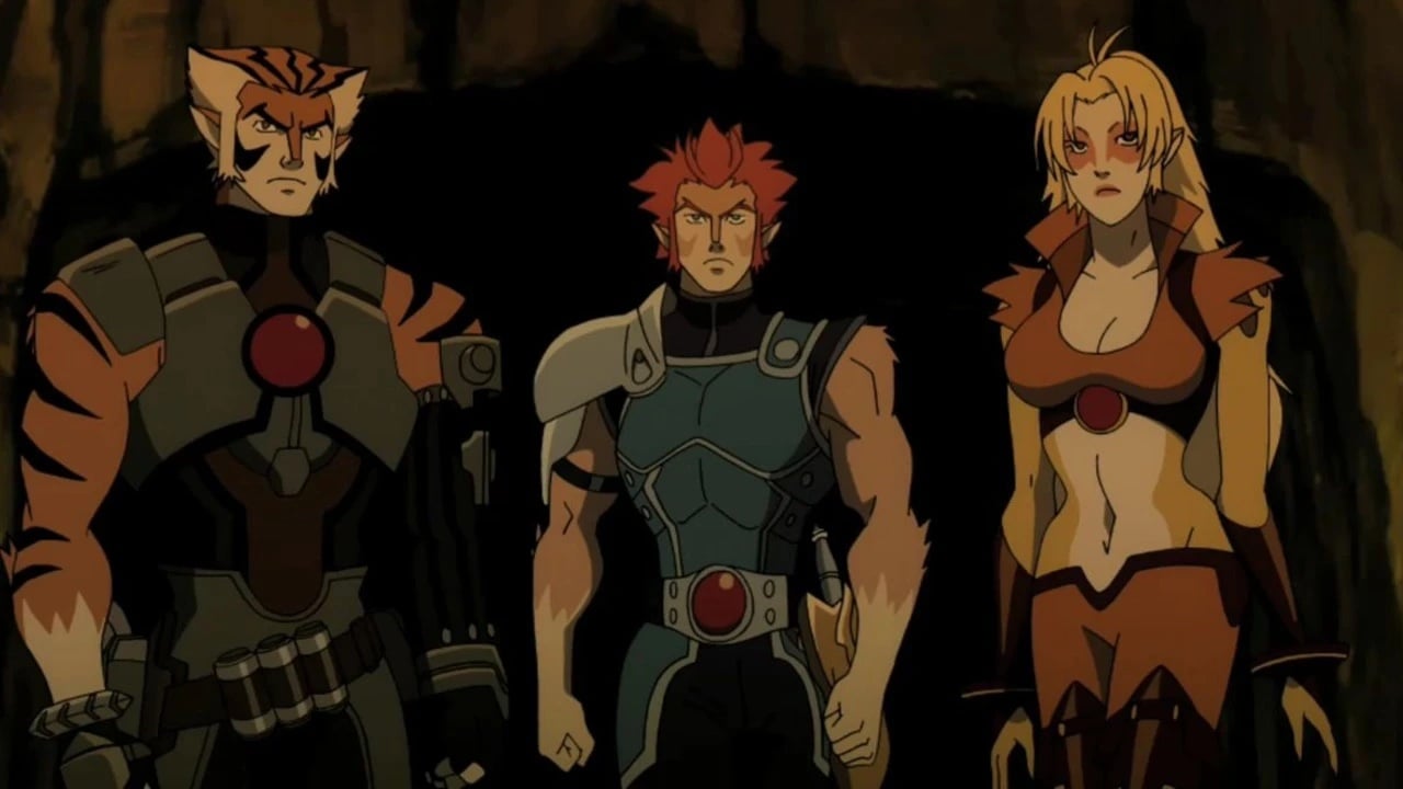 Three animated characters with feline features and serious expressions stand side by side in a dimly lit setting, wearing distinctive armor with red circular emblems.