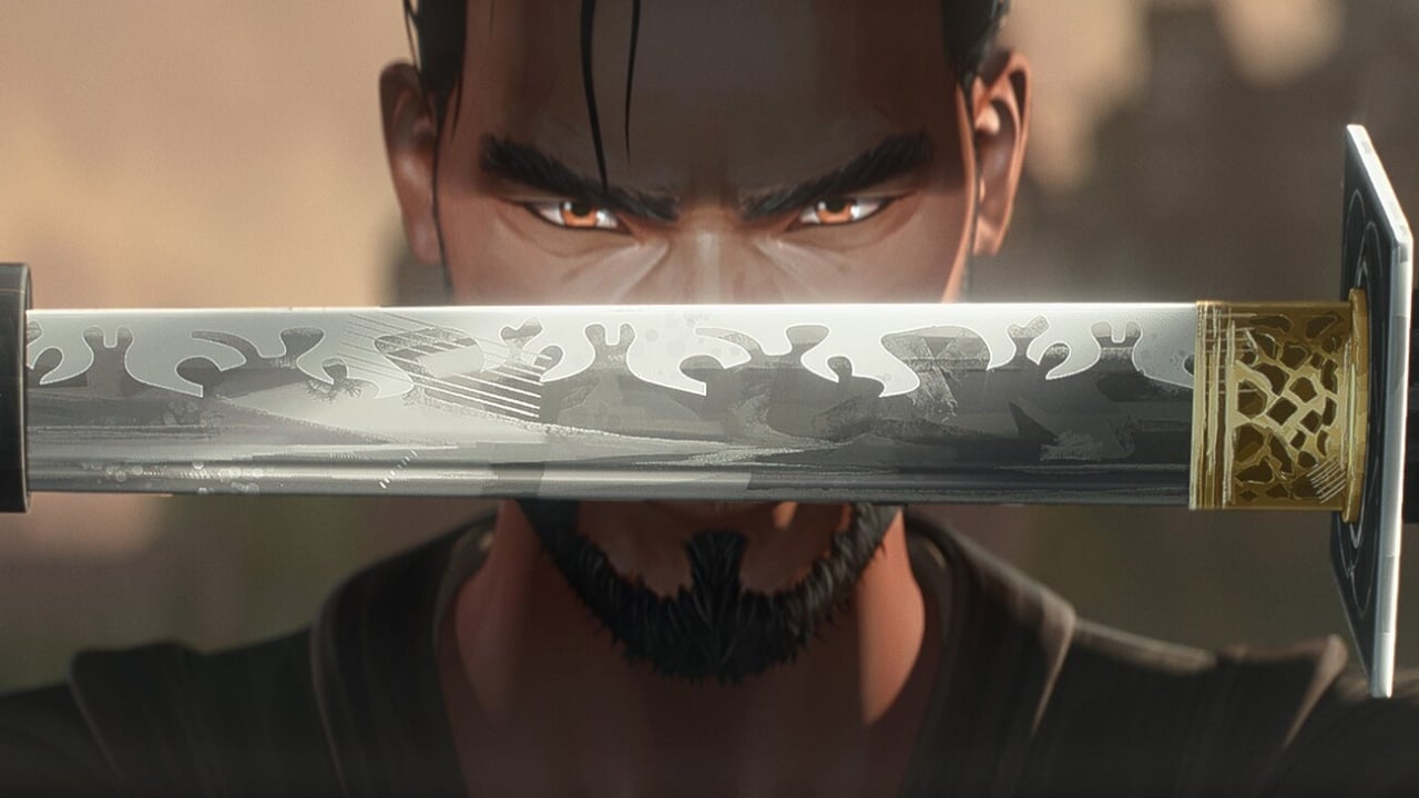 A man holds a decorated sword horizontally in front of his face, focusing intently with both eyes visible above the blade.