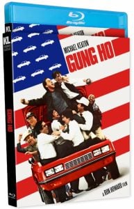 Blu-ray cover of the film "Gung Ho," featuring a group of people cheering on top of a red car, with a stylized American flag background.