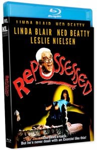 Blu-ray cover for the film "Repossessed," featuring actors' names, a comedic image of Leslie Nielsen's face, and a woman levitating above a bed with a frightened man beside her.