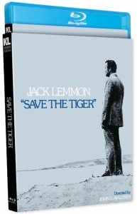 Blu-ray cover of "Save the Tiger" featuring Jack Lemmon in profile standing on sand, with the movie title and director John G. Avildsen's name on a gray background.