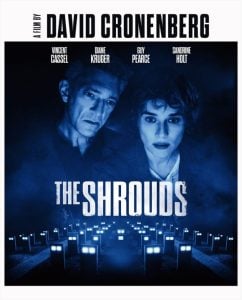 Movie poster for "The Shrouds" shows two people looking down, with illuminated grave markers in the background and cast names at the top.