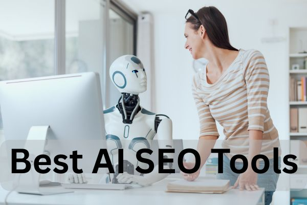 A woman stands beside a humanoid robot at a desk with a computer; text reads "Best AI SEO Tools.