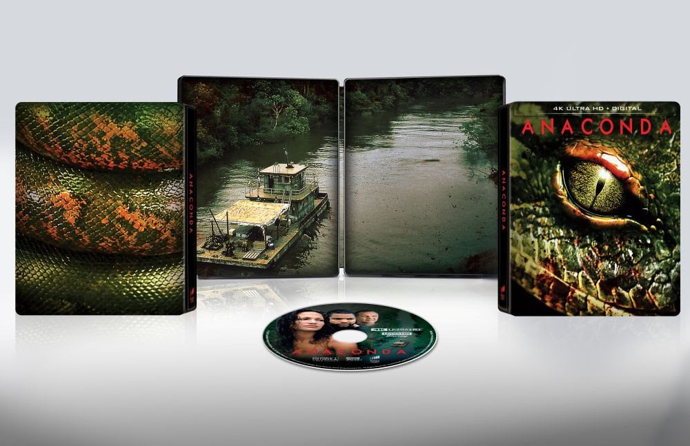 An "Anaconda" 4K Ultra HD movie set is displayed with a disc, slipcover featuring a snake's eye, and open case showing a river scene and snake skin pattern.