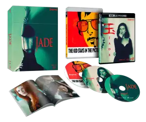 A collector's set featuring the film "Jade," its 4K Ultra HD case, "The Kid Stays in the Picture" Blu-ray, three discs, and an open booklet with images and text.