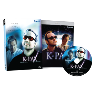 Blu-ray package for the movie "K-PAX," showing the box, disc, and case with images of characters wearing sunglasses against a blue cosmic background.