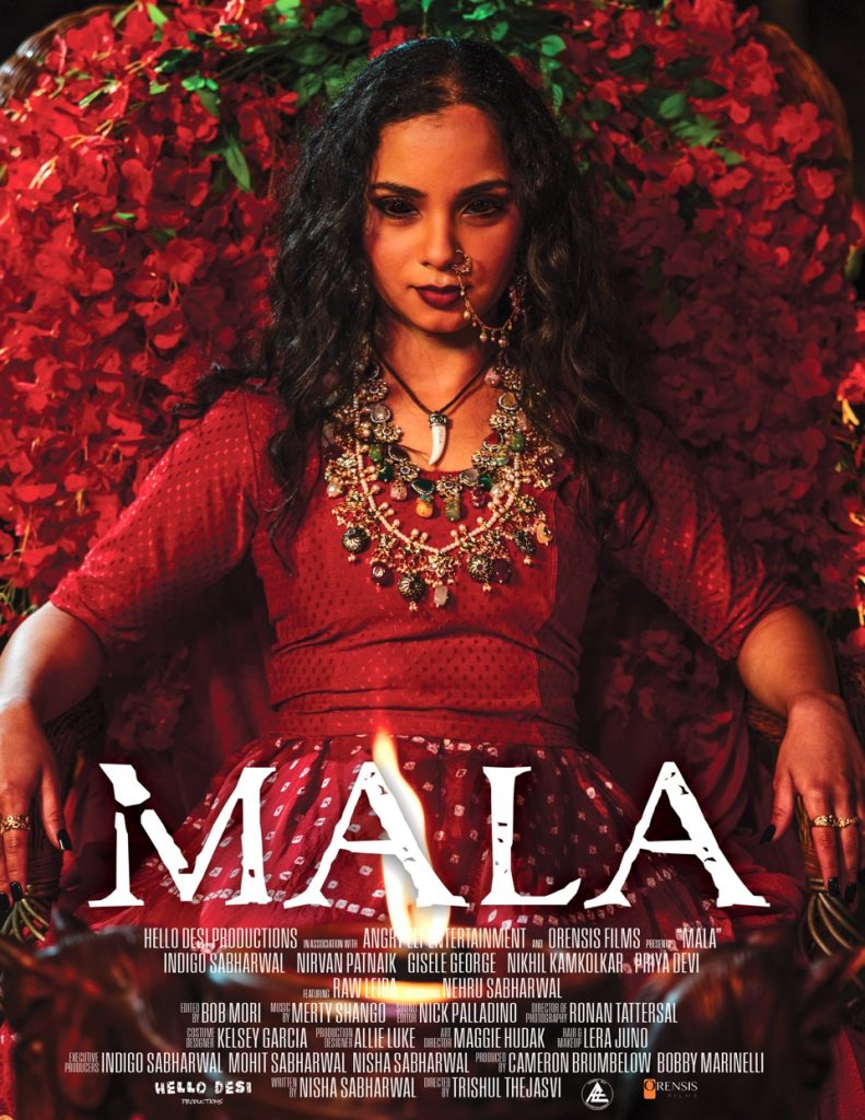 A woman in a red dress and ornate jewelry sits in front of a backdrop of red flowers. The word "MALA" is prominently displayed at the bottom along with film credits.