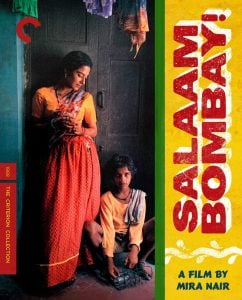 A woman stands against a doorway while a boy sits on the ground beside her; bright text reads "Salaam Bombay! A Film by Mira Nair.