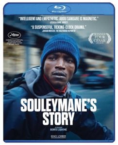 Blu-ray cover for "Souleymane's Story," featuring a man in a blue hoodie and jacket, with festival awards and critic quotes displayed at the top.