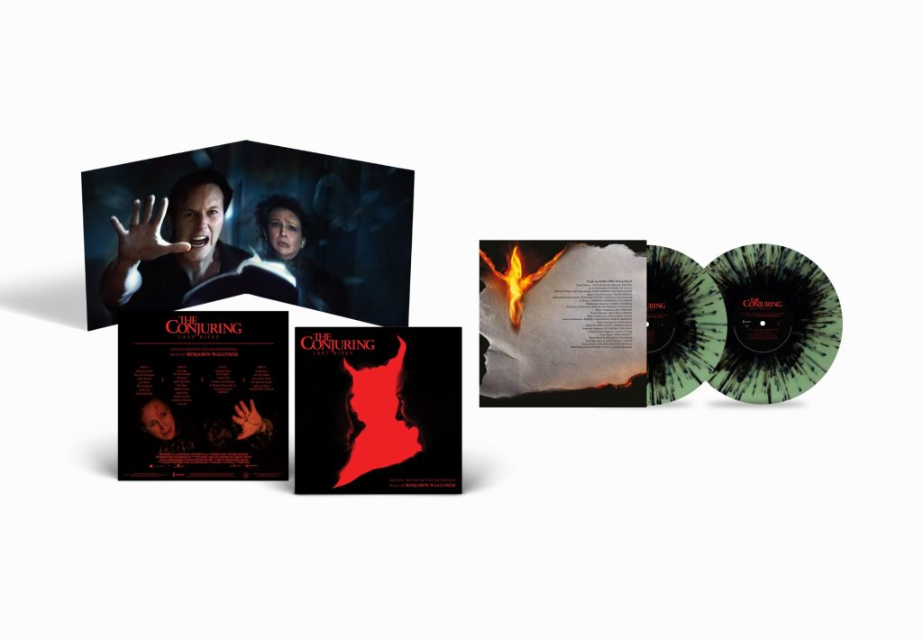 A vinyl record set of "The Conjuring" soundtrack, featuring splatter-patterned discs, album art with a red silhouette, and an open booklet with photos from the film.