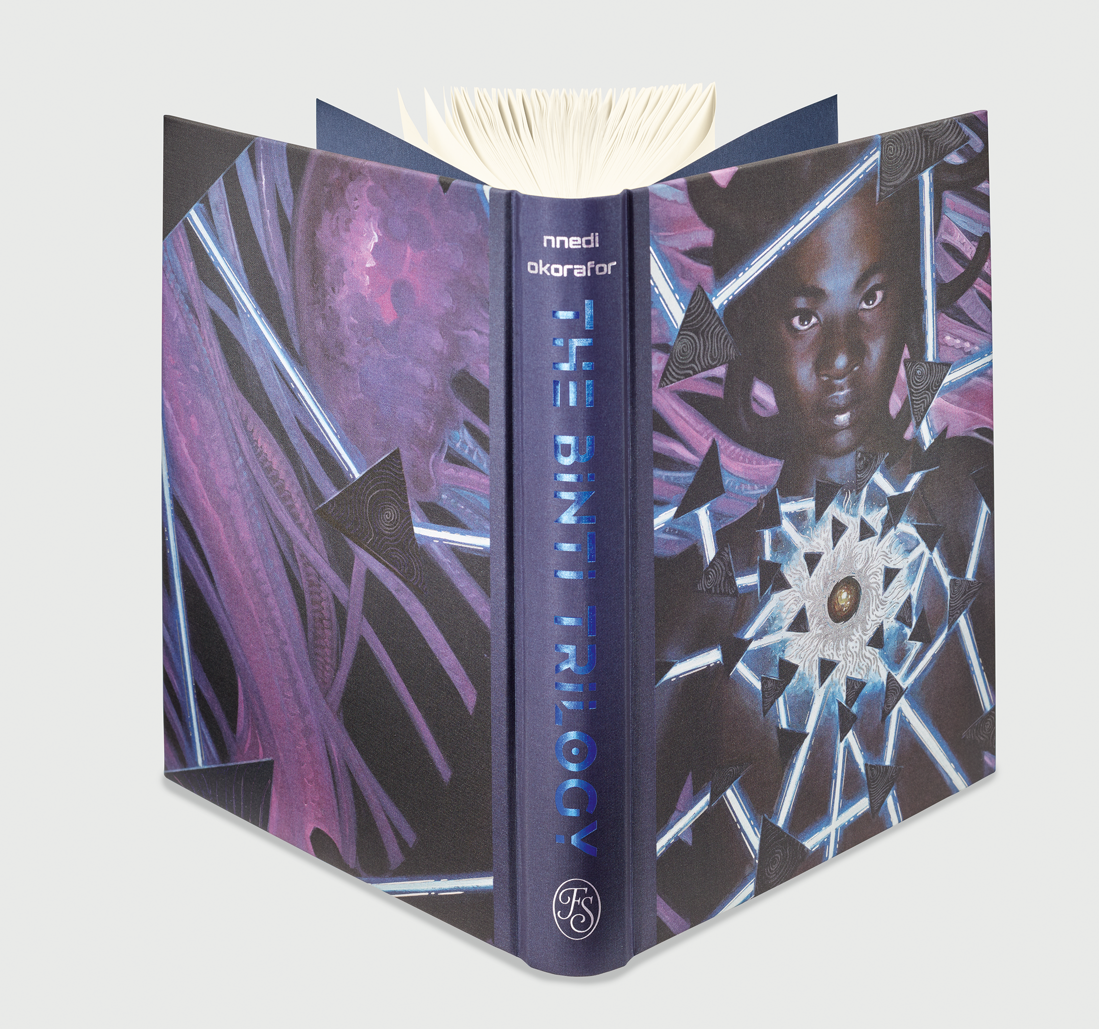 A hardcover book titled "The Binti Trilogy" by Nnedi Okorafor, featuring abstract purple and blue artwork and a central portrait of a person with geometric patterns.