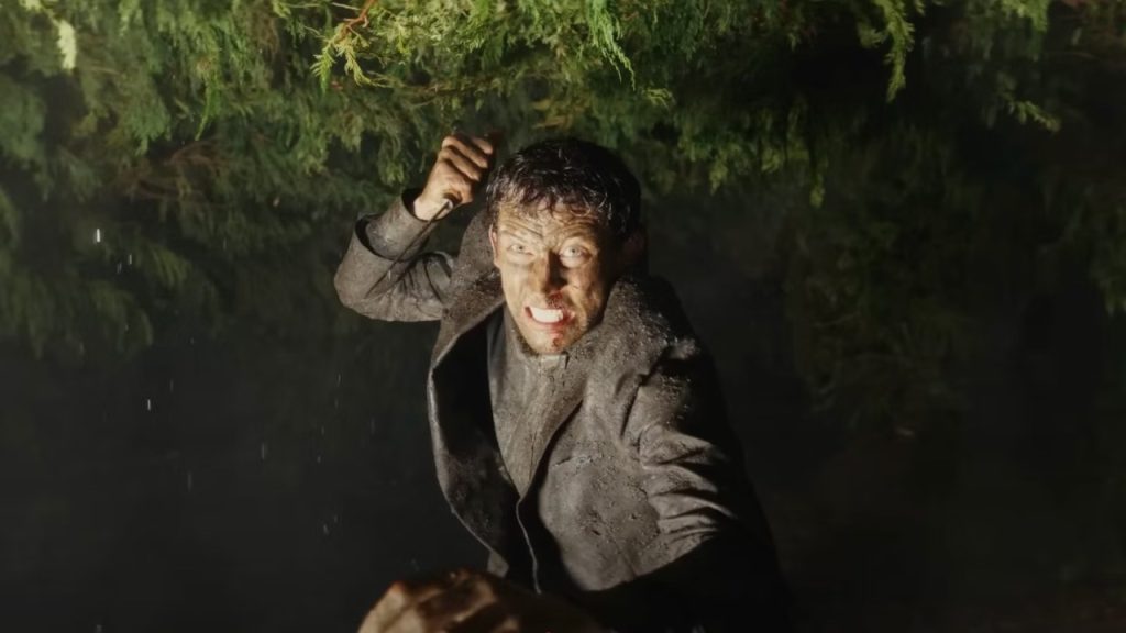 Josh O'Connor holding knife in Wake Up Dead Man