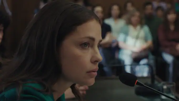 A woman in front of a microphone.