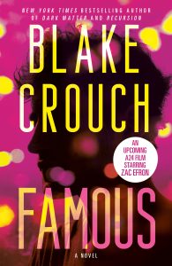 Book cover for "Famous" by Blake Crouch, featuring a silhouette of a man's profile against a pink background with yellow bokeh and text about an upcoming film adaptation starring Zac Efron.