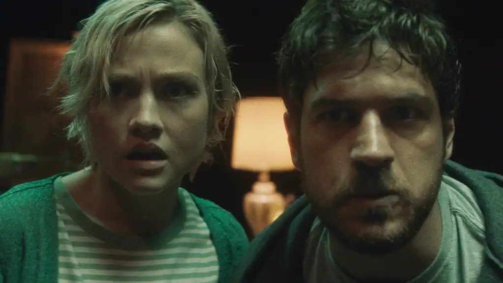 A man and woman looking at camera.