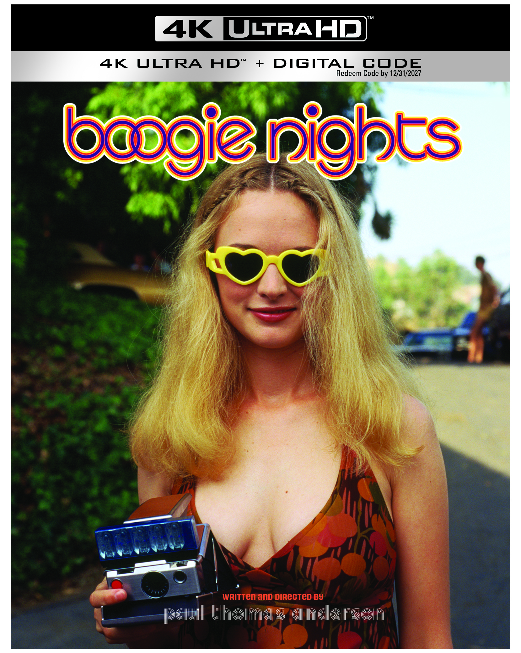 A young woman with long blonde hair, wearing heart-shaped yellow sunglasses and a patterned dress, holds a camera. The cover reads "boogie nights" and "4K ULTRA HD".