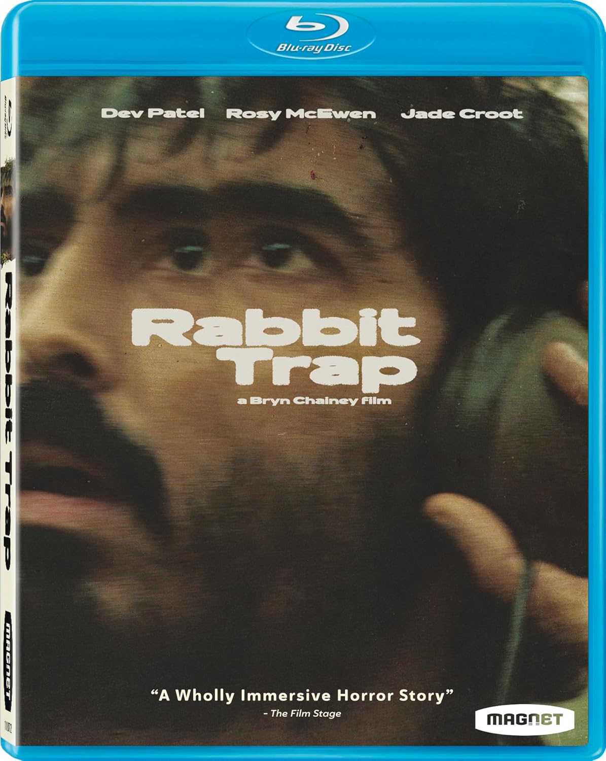 Blu-ray cover for "Rabbit Trap," featuring a close-up of a man's face looking up, with the names Dev Patel, Rosy McEwen, and Jade Croot listed at the top.