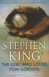 A baseball glove holds a baseball on the cover of Stephen King's novel "The Girl Who Loved Tom Gordon.