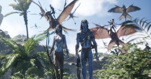Two blue-skinned humanoid figures walk through dense jungle while flying creatures and riders soar in the sky behind them.