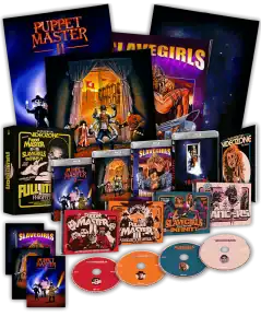 A boxed set of DVDs and Blu-rays with cover art for "Puppet Master II" and "Slave Girls," including cases, discs, posters, and collectible cards displayed on a black background.