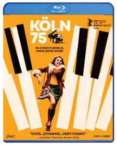 Blu-ray cover for "Köln 75" featuring a woman joyfully running on piano keys, with text about the Berlin Film Festival and a review calling the film vivid, dynamic, and very funny.