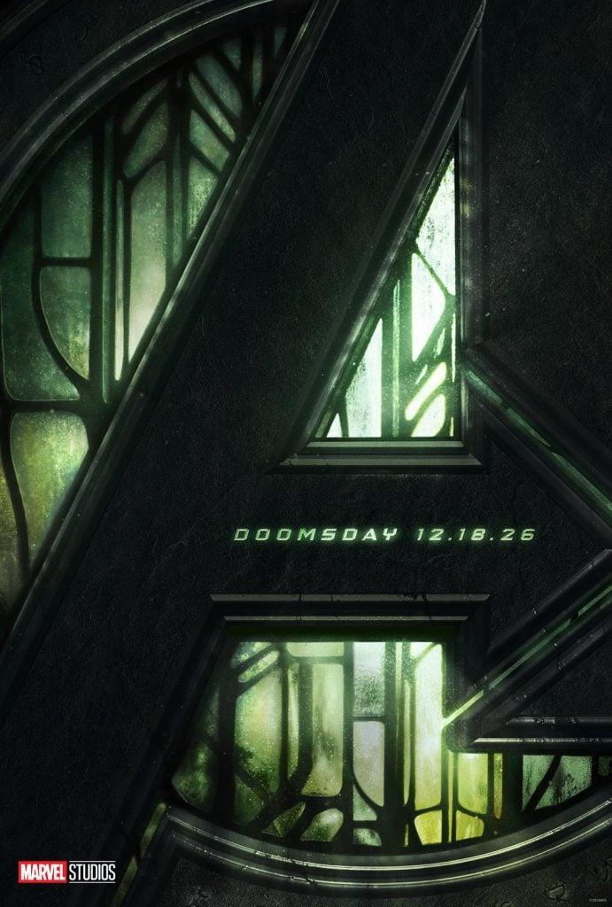 Dark, metallic Avengers "A" logo with green backlight and stained glass pattern; text reads "DOOMSDAY 12.18.26." Marvel Studios logo in the bottom left corner.