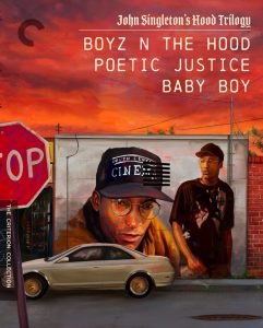 A wall mural of two men in urban clothing is shown near a stopped car, with a stop sign in the foreground and a sunset sky. Text lists films: Boyz N the Hood, Poetic Justice, Baby Boy.