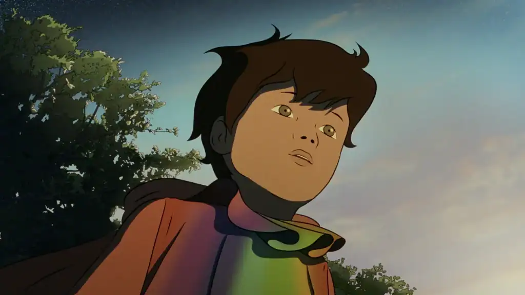 Animated child with brown hair and green eyes looks upward, wearing a red cloak, with trees and a blue sky in the background.