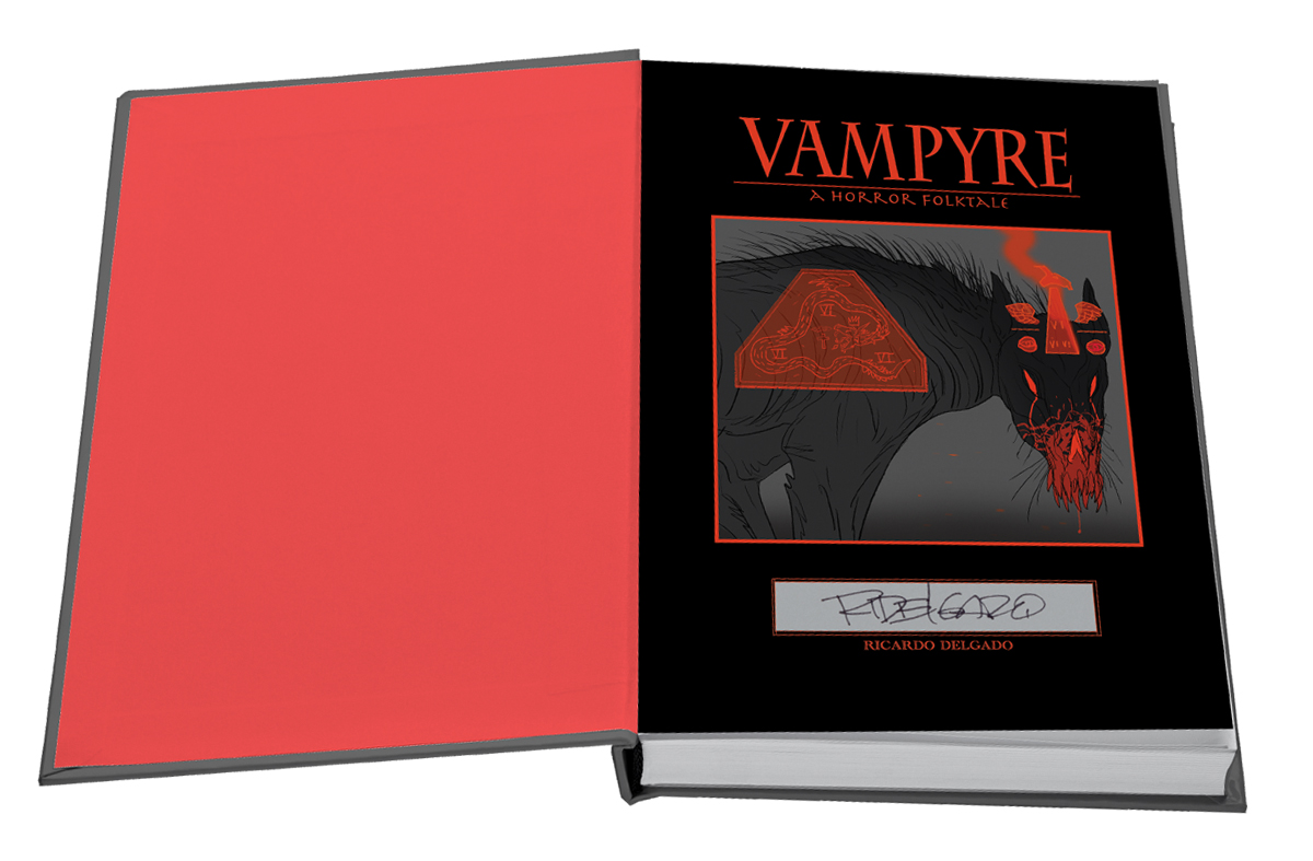 A hardcover book titled "Vampyre: A Horror Folktale" by Ricardo Delgado, featuring a signed title page with red and black artwork of a monstrous creature.