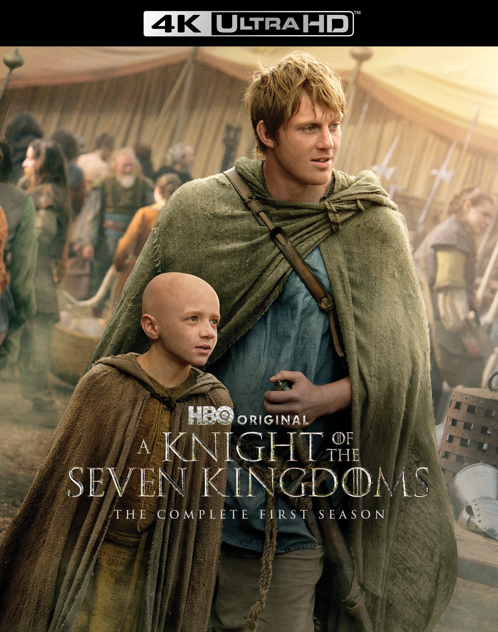 A man and a bald child in medieval clothing stand together in a crowded camp. Text reads: "A Knight of the Seven Kingdoms, The Complete First Season, HBO Original, 4K Ultra HD.