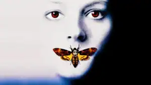A close up of a face with a moth on it.