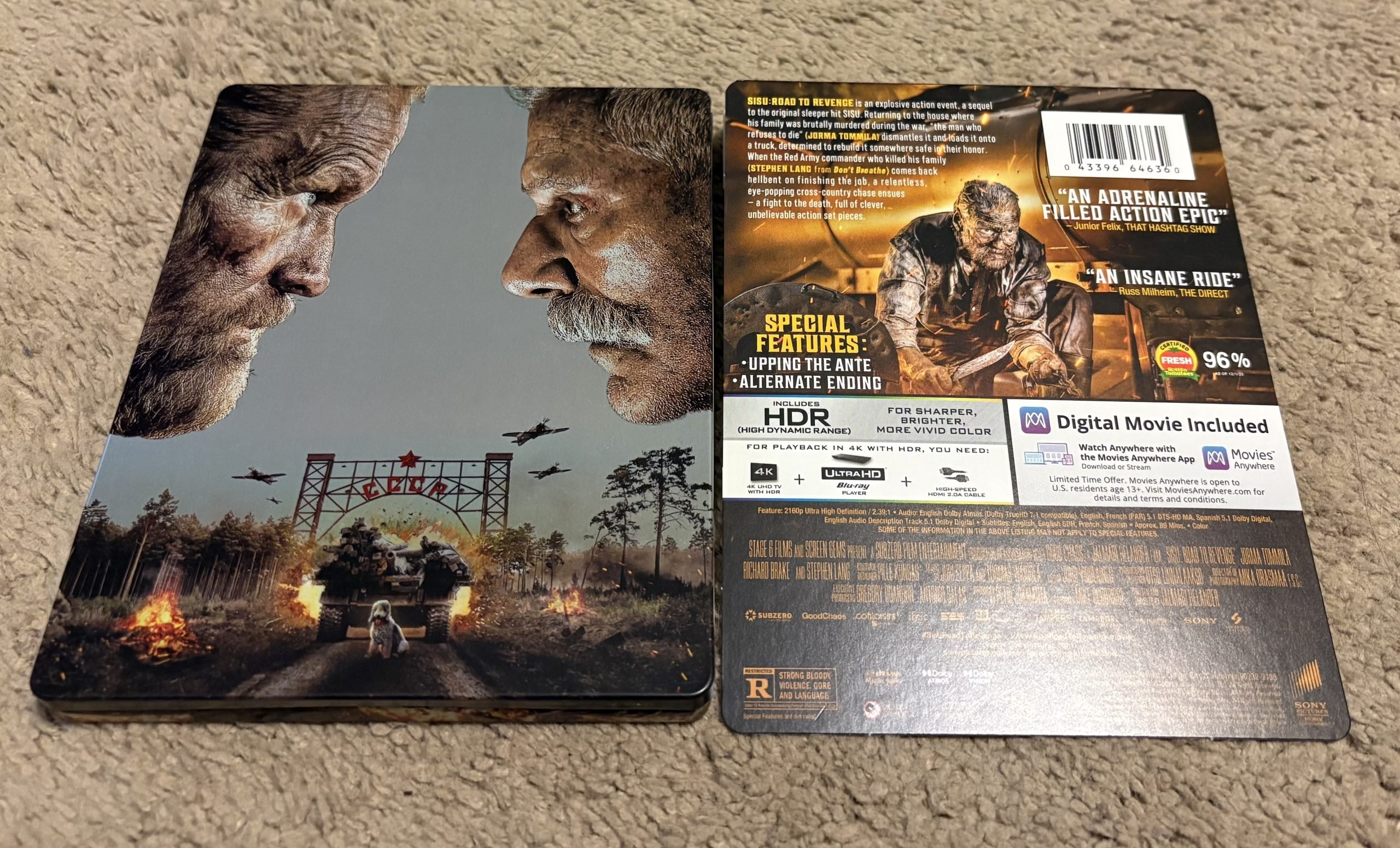 Steelbook case of “Don’t Breathe 2” opened to show front cover and back, featuring character faces, special features, and digital movie code on a beige carpet background.