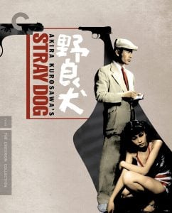 A man in a suit and hat writes in a notebook while a woman in a red dress sits beside him. The title "Stray Dog" and gun graphics are displayed prominently on the cover.