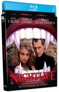 Blu-ray cover of the film "Nightlife," featuring two characters in front of an open vampire mouth graphic. The tagline reads: "After a hundred years, she could really use a drink!.