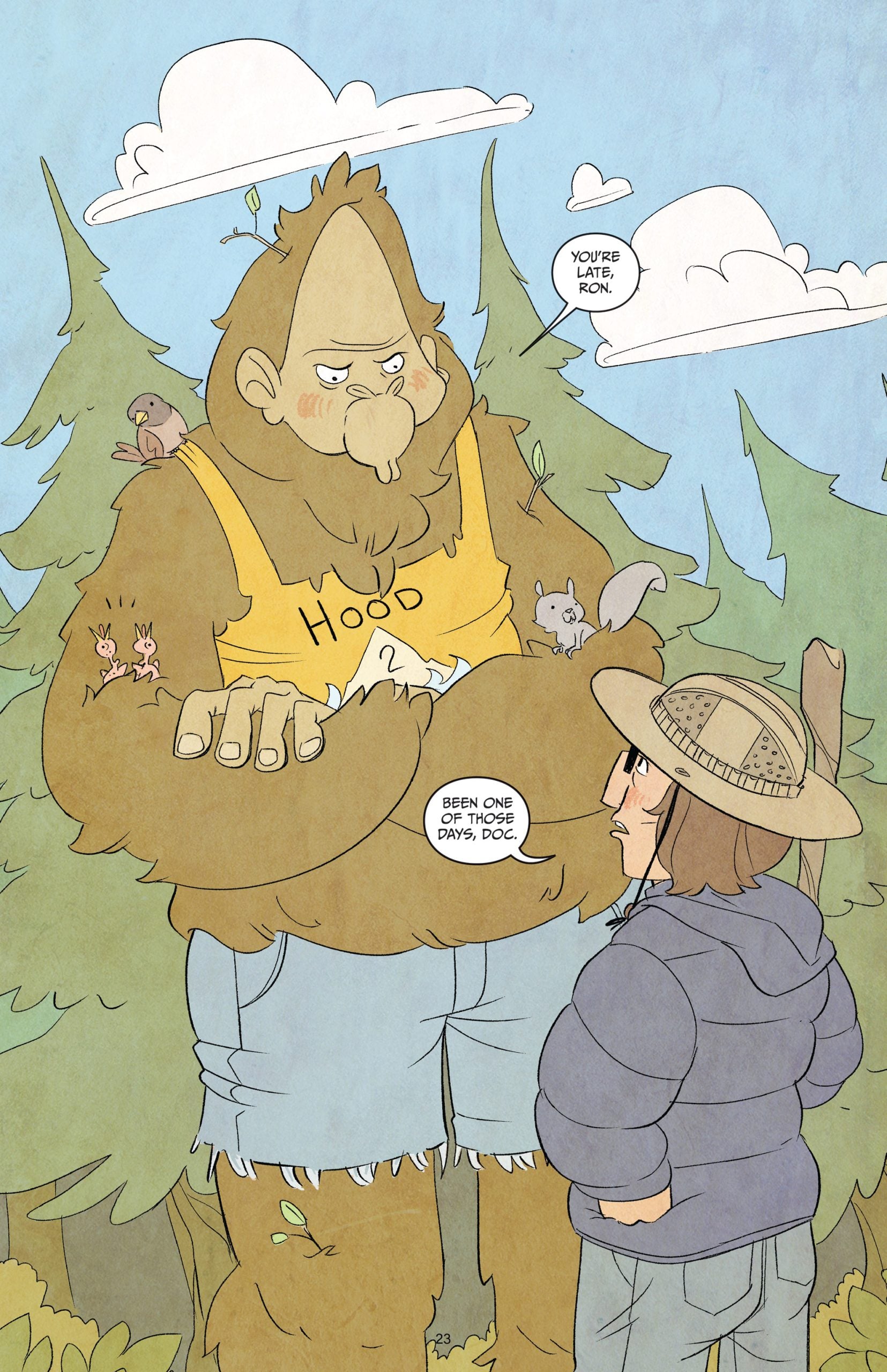 A large, friendly Bigfoot wearing a yellow "Hood" tank top and shorts talks to a young boy in a hat and puffy jacket in a forest, with small animals on Bigfoot's arm.