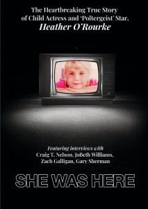 Movie poster for a documentary about child actress Heather O’Rourke, showing her photo on a TV and listing interviewees’ names. Title text reads “She Was Here.”.