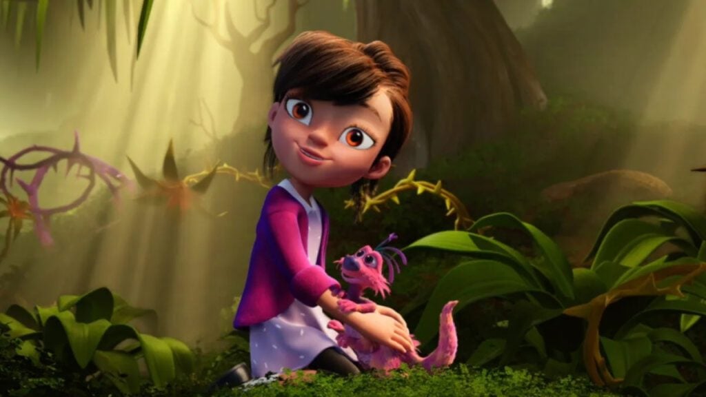 Animated girl with brown hair sits in a forest, smiling while holding a small pink creature with purple antennae. Sunlight streams through the trees.