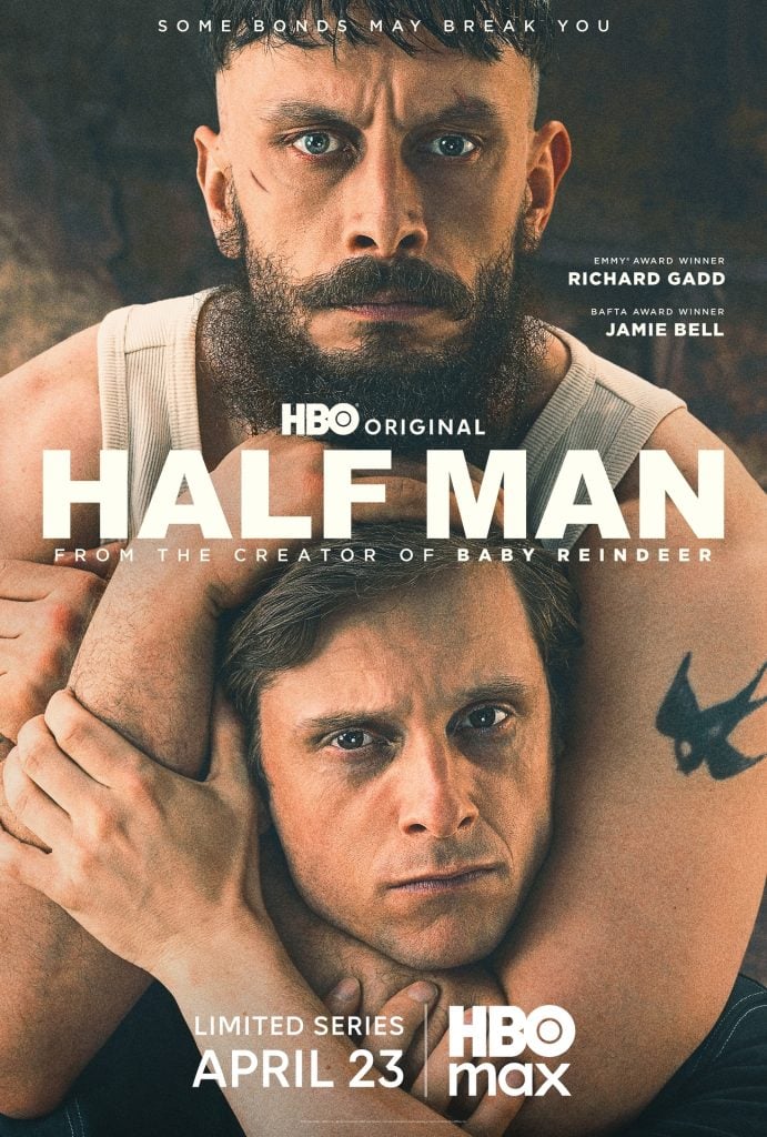 Two men are intertwined closely, one wrapping his arms around the other's neck, on the poster for the HBO original limited series "Half Man," premiering April 23 on HBO Max.