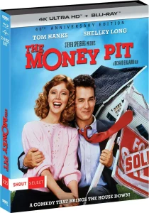 Blu-ray and DVD cover for "The Money Pit" shows Tom Hanks and Shelley Long smiling in front of a collapsing house with a “For Sale” sign. Text highlights it as a 40th anniversary edition.